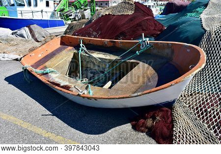Portosin, Spain. July 3, 2020. Old Galician Wooden Rowboat In A Harbor. Coruña Province, Rias Baixas