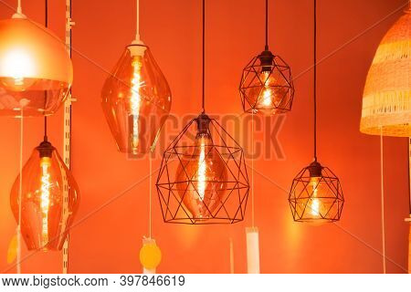 Many Pendant Lamps In Different Geometric Shapes With A Vintage Glowing Spiral Of Warm Light