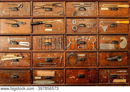 A Detail Of An Old Cupboard With Drawers, Part Of The Old Vintage Ironmongery.