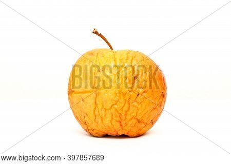 A Picture Of An Ordinary Apple, Without Modifications The Apple Is Old, Dry An Not Attractive. It Is