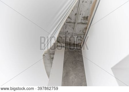 Stretch Ceiling. Workers Stretch The Suspended Ceiling In The Room. Ceiling Installation.