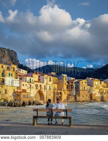 Cefalu, The Medieval Village Of Sicily Island, Province Of Palermo, Italy. Europe, A Couple On Vacat