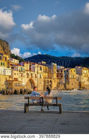 Cefalu, The Medieval Village Of Sicily Island, Province Of Palermo, Italy. Europe, A Couple On Vacat