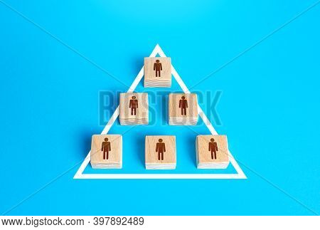 Blocks Of People Figurine Are United Into One Structure Organization. Combining Efforts To Achieve G