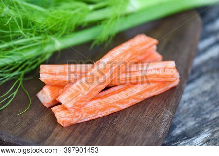 Crab Sticks On Wooden Cutting Board And Vegetable , Fresh Crab Sticks Surimi Ready To Eat Japanese F