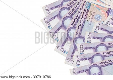 100 Philippine Piso Bills Lies Isolated On White Background With Copy Space. Rich Life Conceptual Ba