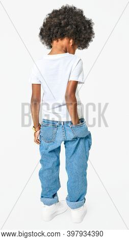Black boy wearing t-shirt with pants in studio