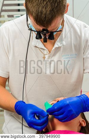 Rozhnyativ, Ukraine September 15, 2020: Dentist Uses Rubber Dam For Sterile Work And Dental Treatmen