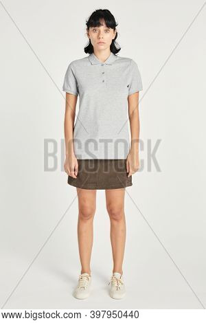 Woman wearing a skirt and a gray collared shirt mockup