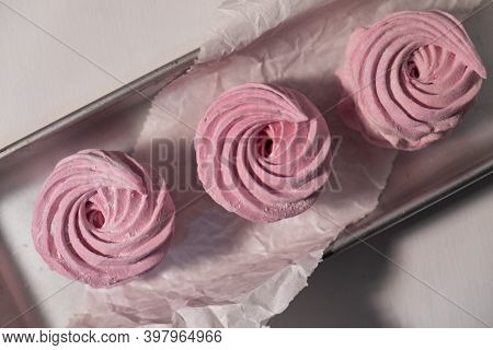 Pink Strawberry Homemade Zephyr Or Marshmallow In A Rectangular Oleum Plate. Side View.