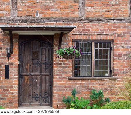 28 November 2020 - Denham, England: Door, Porch And Window Of Old Village House
