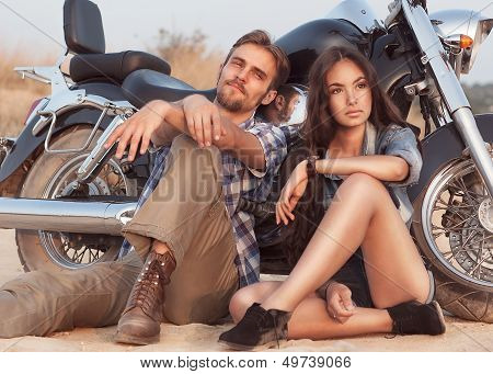 Happy Young Love Couple On Scooter Enjoying Themselves On Trip