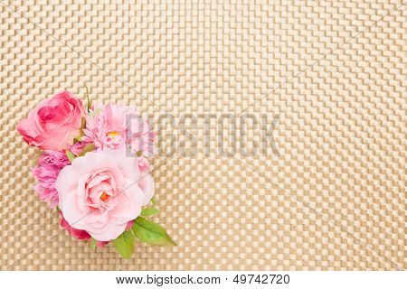 Artificial Rose On The Table Cloth