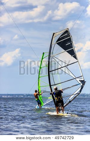 Two Windsurfers In Action