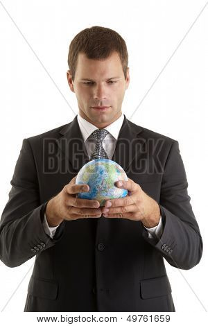 Businessman holding globe