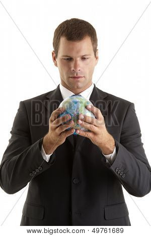 Businessman holding globe
