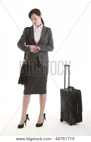 Young business traveller checking the time