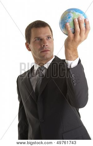 Businessman holding globe