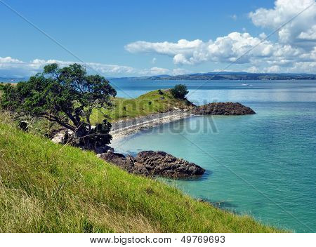 View Onto A Beach With Sea And Islands In The Background