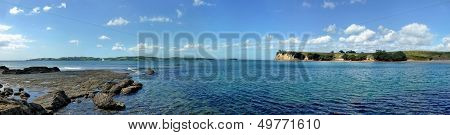 Panoramic View From A Shore Onto The Sea With Islands