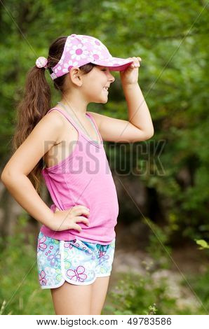 Little preety happy girl in garden