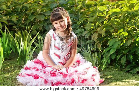 Little preety happy girl in garden