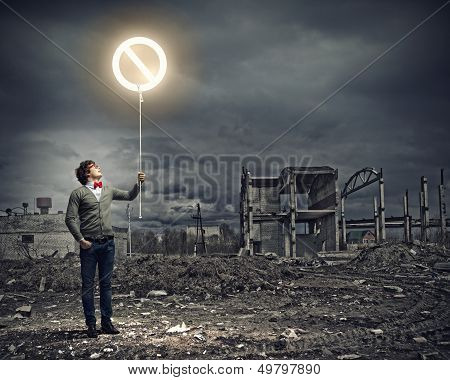 Young man and stop sign