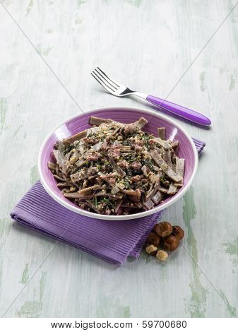 pizzocheri with sausage spinach and hazelnut