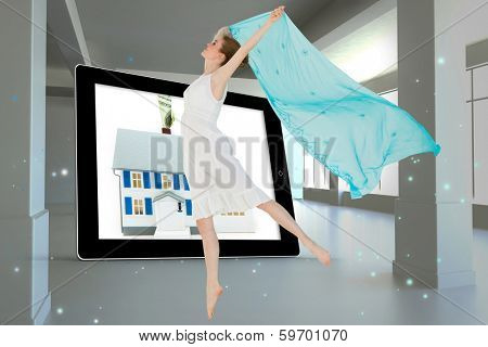 Young beautiful female dancer with blue scarf against screen in room with sparks