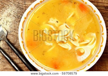 Canned Chicken Noodle Soup in Bowl on Table