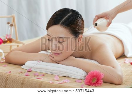 .a Young Woman Enjoying Massage.