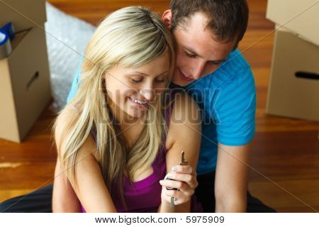 Woman And Man With A Key. Buying New House