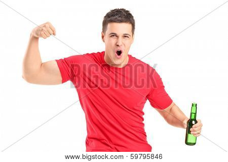 Euphoric fan holding a beer bottle and cheering isolated on white background