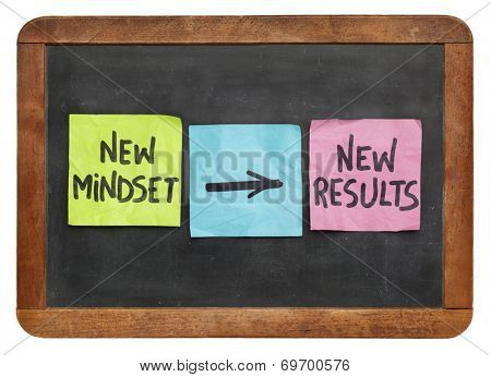 new mindset and new results  concept - colorful sticky notes on a vintage slate blackboard  isolated on white