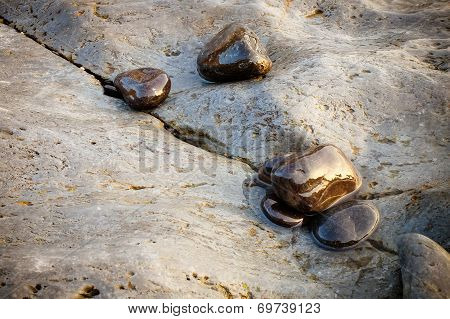 Wet Stones On The Beach