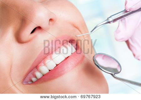 Human Teeth With Hatchet And Mouth Mirror