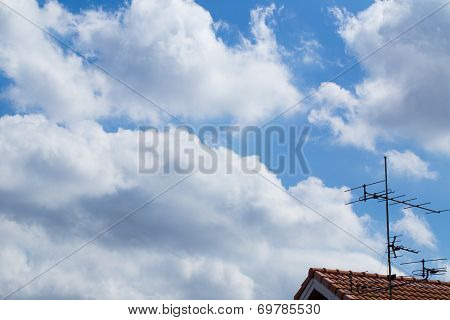 Antenna Tv With Clouds In The Blue Sky .