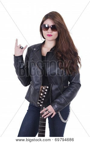 Beautiful  young rocker girl wearing leather jacket and posing