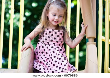 Girl Playing At The Playground