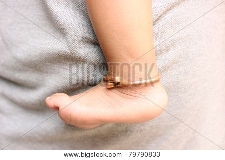 Close up of an Indian baby's feet wearing copper ornament