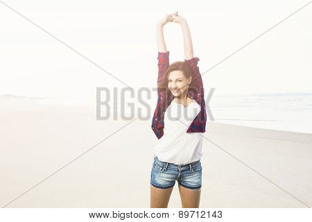 Portrtait of a happy girl at the beach enjoying the life