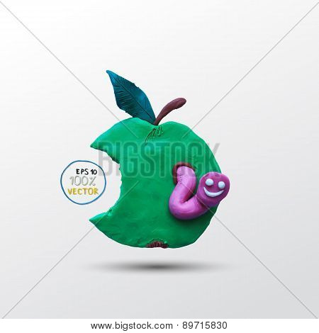 Funny plasticine worm in the apple