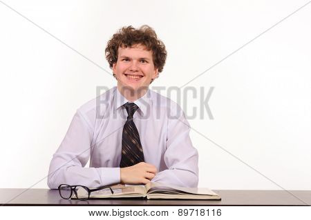 business man sitting at table and reading book isolated on white