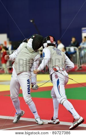 ST. PETERSBURG, RUSSIA - MAY 2, 2015: Baptiste Mourrain of France vs Edoardo Luperi of Italy in 1/64 final of International fencing tournament St. Petersburg Foil, the stage of FIE World Cup