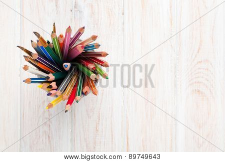 Office desk table with colorful pencils. Top view with copy space