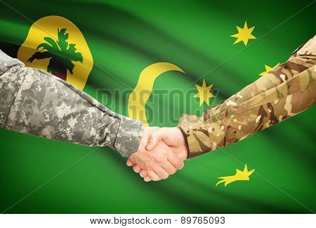 Men In Uniform Shaking Hands With Flag On Background - Cocos (keeling) Islands