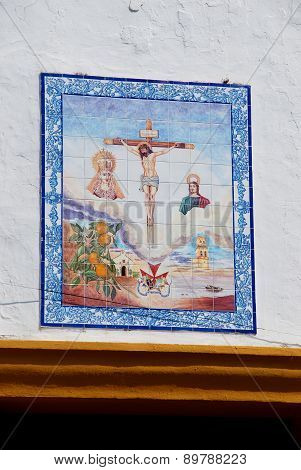 Crucifix on church wall, Marbella.