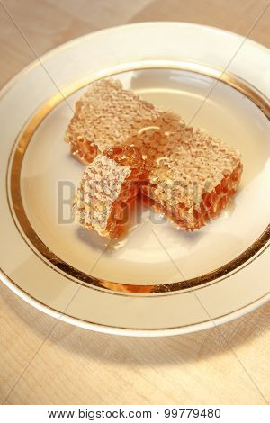 Stacks Of Honey Comb On A Plate On Wooden Table