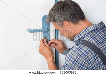 Lockpicker Fixing Door Handle At Home