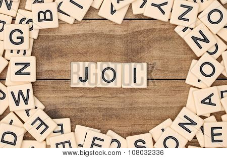Joi - Joy In French Spelled Out In Tan Tile Letters